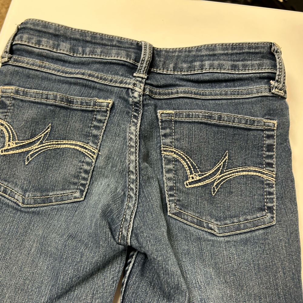 Girls size 8 wrangler boot, cut flare jeans with adjustable straps